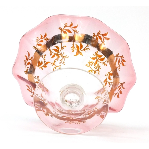 634 - Moser pink and clear glass pedestal dish with frilled rim, hand painted and gilded with flowers, fac... 