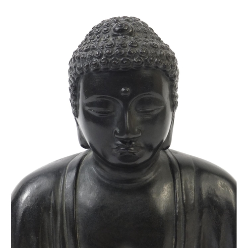 569 - Oriental Chinese bronze seated Buddha, character marks to the reverse, 20cm high