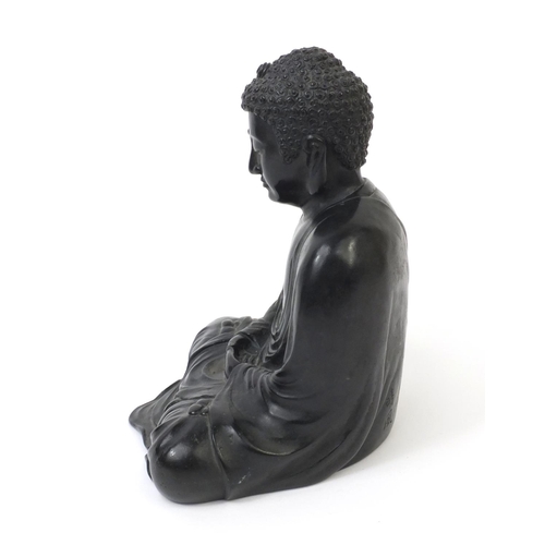 569 - Oriental Chinese bronze seated Buddha, character marks to the reverse, 20cm high