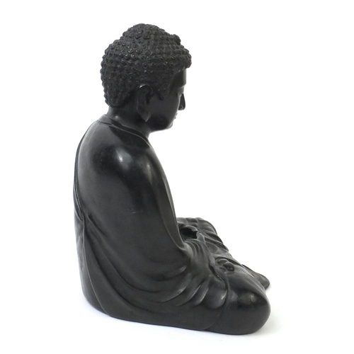 569 - Oriental Chinese bronze seated Buddha, character marks to the reverse, 20cm high