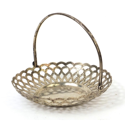 543 - Chinese Wang Hing silver basket with swing handle and pierced decoration, impressed marks to the bas... 