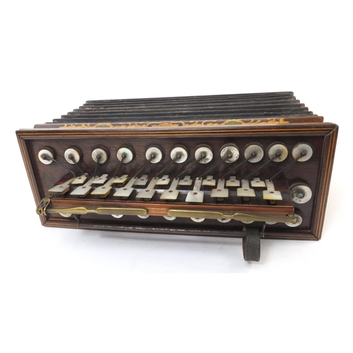 354 - Busson inlaid rosewood flutina with Mother of Pearl keys, impressed Bussin, 33cm wide