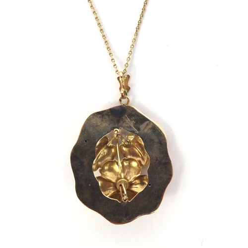 857 - Unmarked gold floral pendant on a 14ct gold necklace, the pendant 4cm long, approximate weight 5.4g