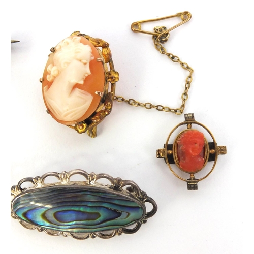 891 - Two silver abalone brooches, an unmarked gold coral cameo brooch and a gilt metal cameo brooch, the ... 