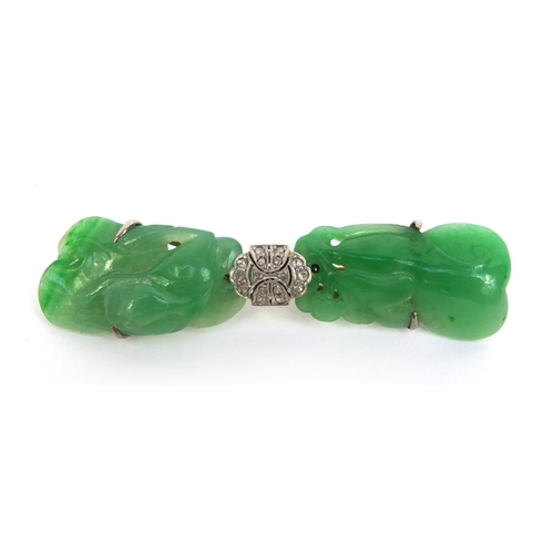 517 - Chinese carved green jade brooch set with diamonds, the jade carved with a dragon, 6.5cm long, appro... 