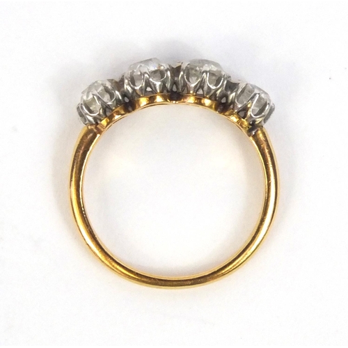 802 - Unmarked gold diamond four stone ring, size K, approximate weight 2.8g