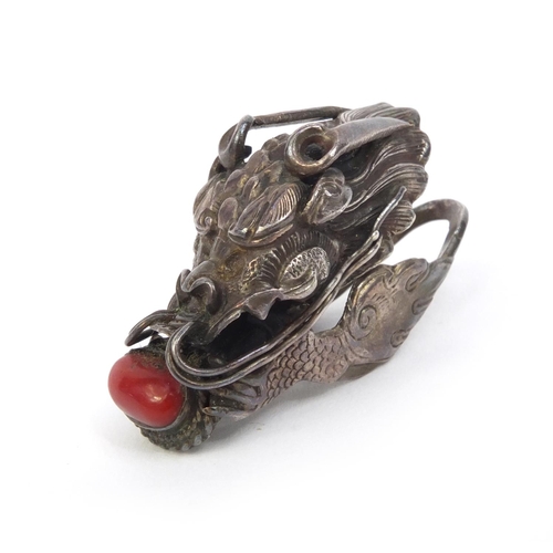 529 - Chinese unmarked silver dragon head ring set with coral, 4.5cm long, approximate weight 10.2g