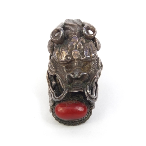 529 - Chinese unmarked silver dragon head ring set with coral, 4.5cm long, approximate weight 10.2g