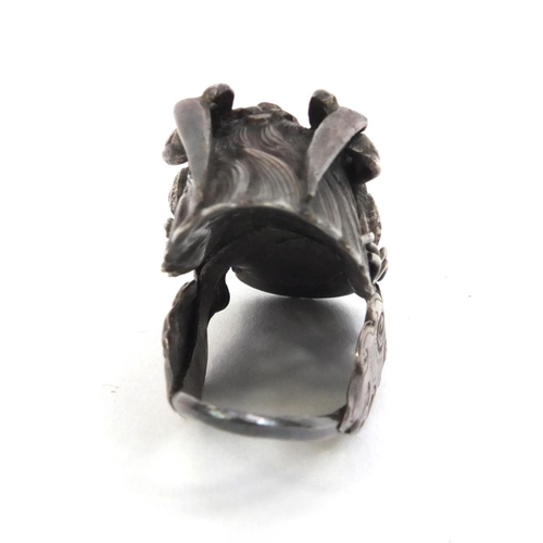 529 - Chinese unmarked silver dragon head ring set with coral, 4.5cm long, approximate weight 10.2g