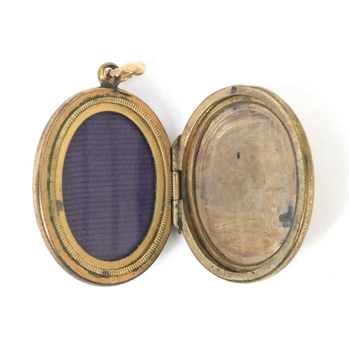 886 - Masonic bloodstone gilt metal locket, with engraved decoration, 3cm long, approximate weight 9.5g