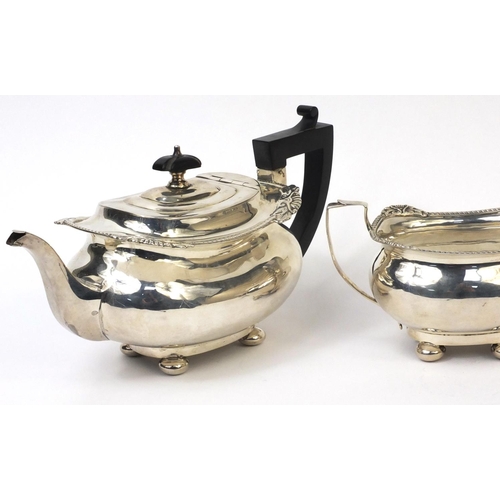 751 - Silver three piece tea service, the teapot with ebonised handle and knop, indistinct Birmingham hall... 