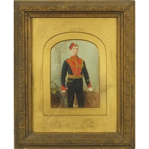 399 - Military interest hand coloured photograph of a gentleman standing in uniform with a swagger stick, ... 