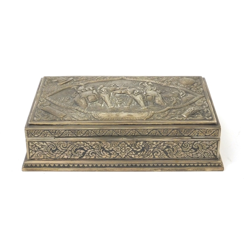 297 - Thainakon sterling silver box profusely embossed with figures on elephant backs, the hinged lid open... 