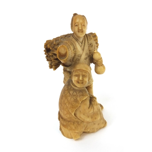 504 - Japanese carved ivory okimono of a wood carrier holding a double gourd sake bottle beside a seated e... 