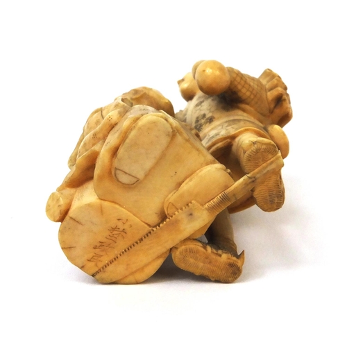 504 - Japanese carved ivory okimono of a wood carrier holding a double gourd sake bottle beside a seated e... 