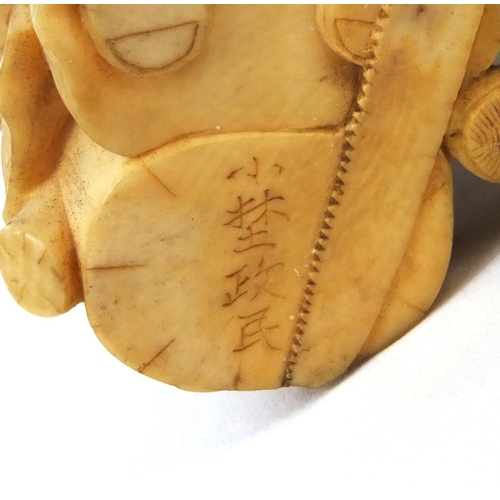 504 - Japanese carved ivory okimono of a wood carrier holding a double gourd sake bottle beside a seated e... 