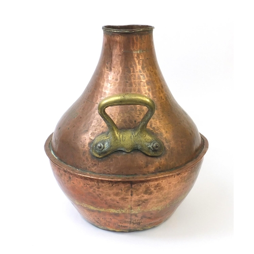 330 - Middle Eastern copper and brass twin handled vessel with Arabic script, 42cm high