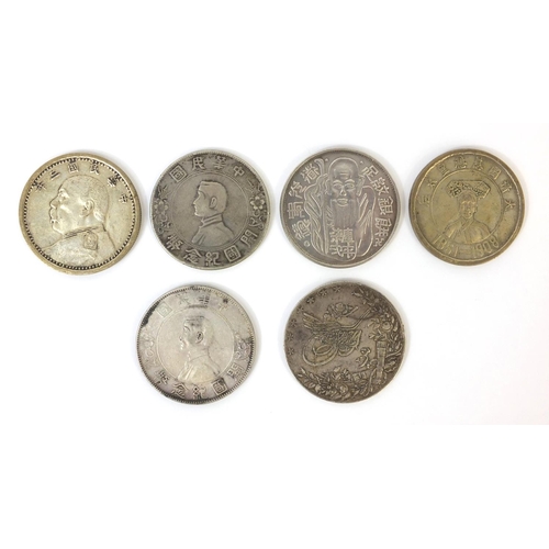 290 - Six Chinese silver coloured dollar size coins, including one fat man examples