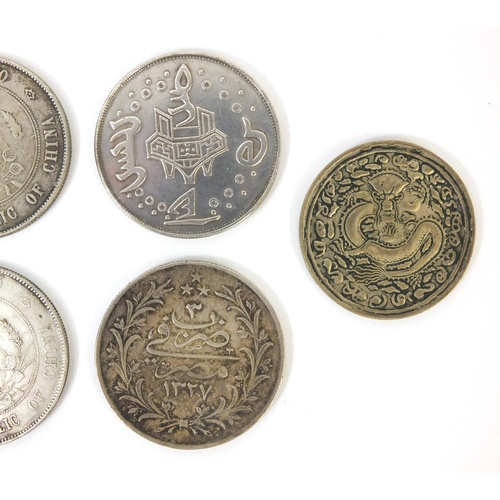 290 - Six Chinese silver coloured dollar size coins, including one fat man examples