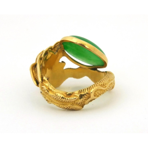 514 - 19th century Chinese 20ct gold and jade ring by Wang Hing, modelled as a dragon chasing a pearl, wit... 