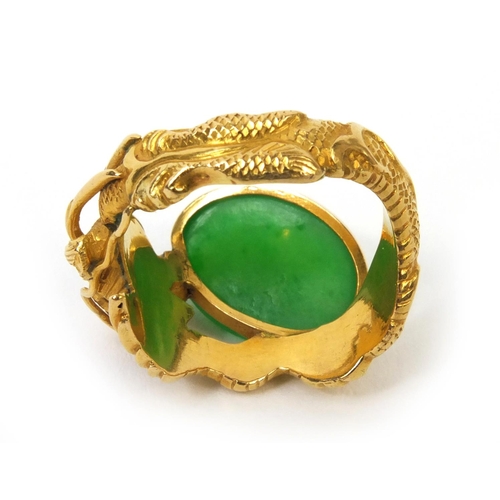 514 - 19th century Chinese 20ct gold and jade ring by Wang Hing, modelled as a dragon chasing a pearl, wit... 