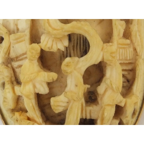 528 - Chinese Cantonese ivory panel housed in a unmarked gold brooch mounts, the ivory panel carved with t... 