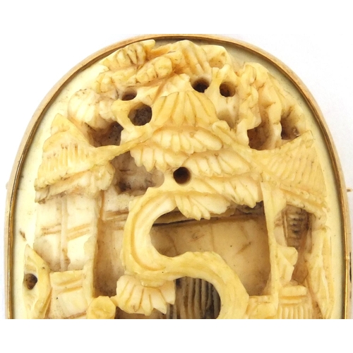 528 - Chinese Cantonese ivory panel housed in a unmarked gold brooch mounts, the ivory panel carved with t... 