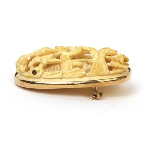 528 - Chinese Cantonese ivory panel housed in a unmarked gold brooch mounts, the ivory panel carved with t... 