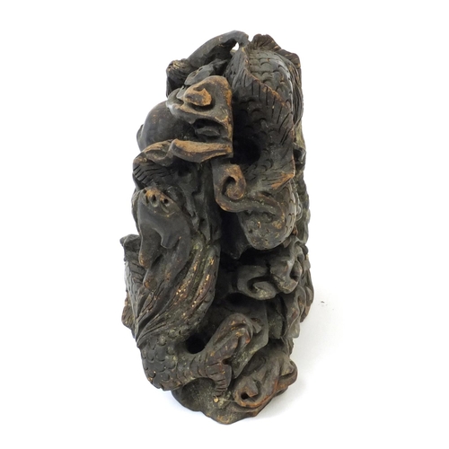 555 - Chinese root carving of two dragons chasing a pearl, 14cm high