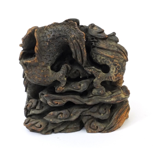 555 - Chinese root carving of two dragons chasing a pearl, 14cm high