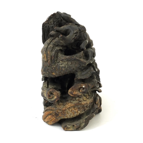 555 - Chinese root carving of two dragons chasing a pearl, 14cm high