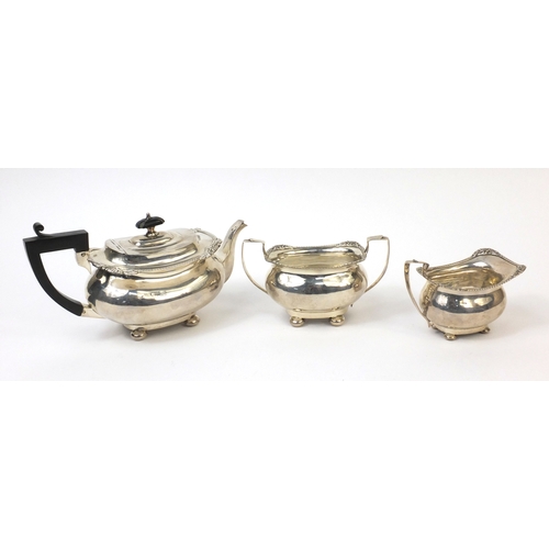 751 - Silver three piece tea service, the teapot with ebonised handle and knop, indistinct Birmingham hall... 