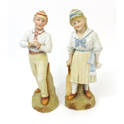 618 - Pair of continental Bisque porcelain cricketers, both numbered 18, the tallest 32cm high