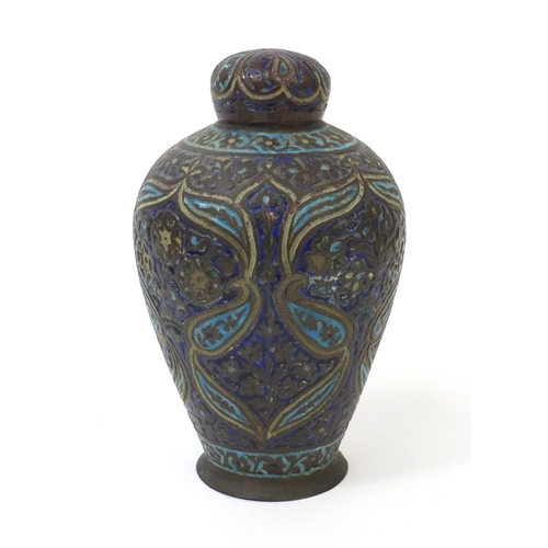 328 - Middle Eastern Islamic copper lidded vase enamelled with flowers and foliage, numbered 16074 to the ... 