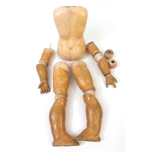 440 - Bisque headed doll with open close eyes and composite body and limbs, the head 15cm high