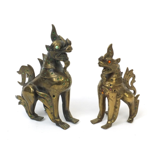 570 - Two Oriental brass figures of mythical beasts both inset with colourful stones, the largest 19cm hig... 