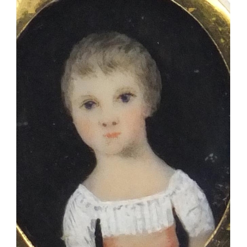 27 - Oval portrait miniature of a child, monogrammed CH, housed in a gilt metal frame, 2.5cm high excludi... 