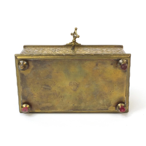 38 - 19th century French brass lockable jewellery casket with red velvet interior, decorated with putti, ... 
