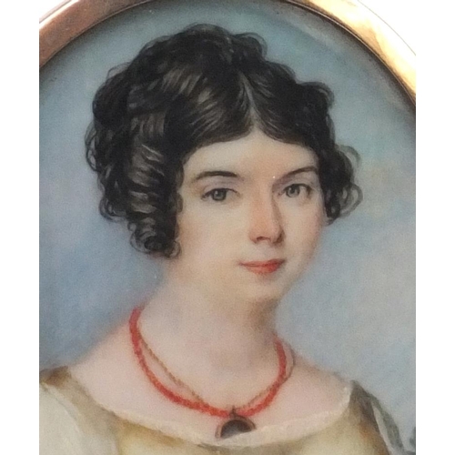 8 - 19th century oval portrait miniature of a lady wearing a coral necklace onto ivory, housed in an unm... 