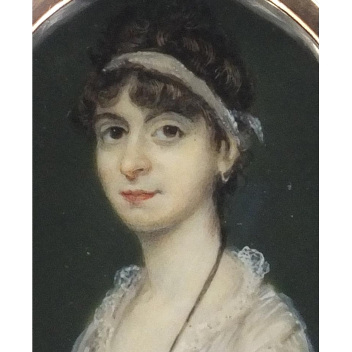 9 - 19th century oval portrait miniature of a lady wearing a white dress, housed in an unmarked gold fra... 