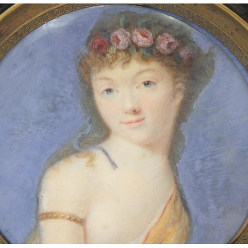 25 - 19th century circular portrait miniature of a semi clad female, housed in an ebonised frame, 6.5cm i... 