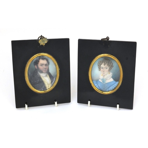 17 - Pair of 19th century oval portrait miniatures, one of a gentleman wearing a black coat the other of ... 