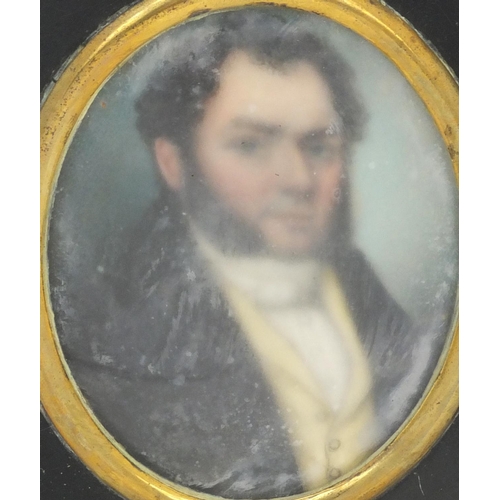 17 - Pair of 19th century oval portrait miniatures, one of a gentleman wearing a black coat the other of ... 