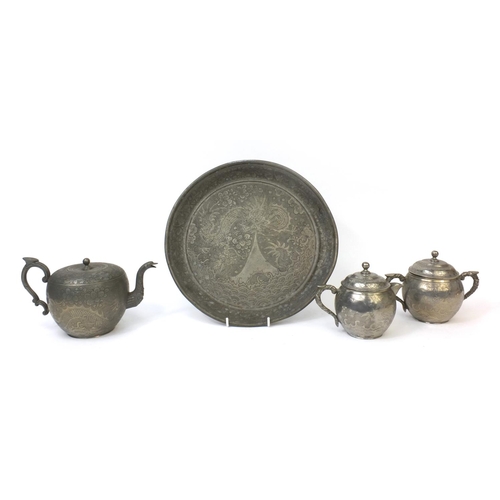 563 - Chinese Kut Hing three piece pewter tea service on tray each piece engraved with dragons, factory ma... 