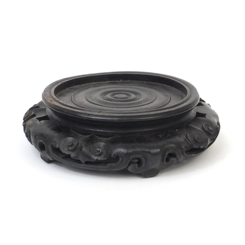 548 - Chinese carved hardwood stand, 7cm high x 21cm in diameter