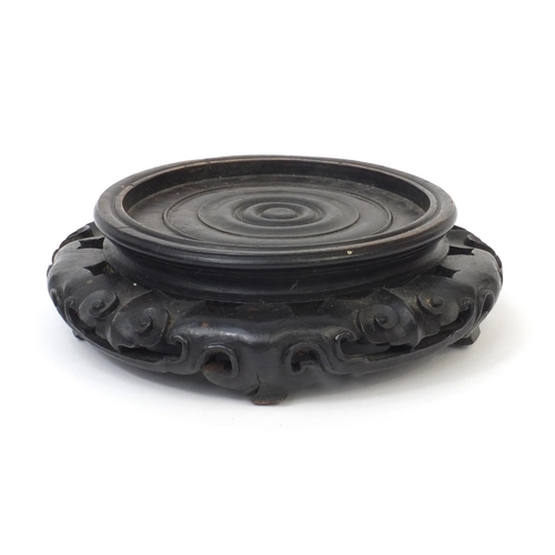 548 - Chinese carved hardwood stand, 7cm high x 21cm in diameter