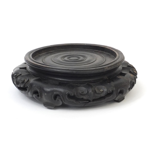 548 - Chinese carved hardwood stand, 7cm high x 21cm in diameter