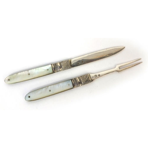 75 - Georgian Mother of Pearl flanked fruit knife and fork with folding silver blades, indistinct hallmar... 