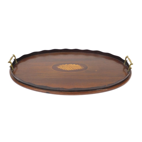 68 - Edwardian oval inlaid mahogany gallery tray with shell inlay and carrying handles, 54cm wide