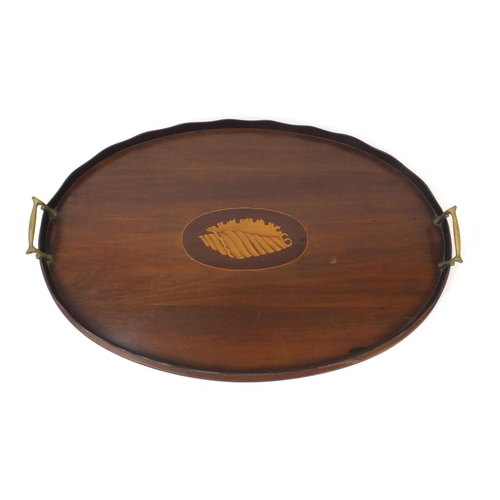 68 - Edwardian oval inlaid mahogany gallery tray with shell inlay and carrying handles, 54cm wide